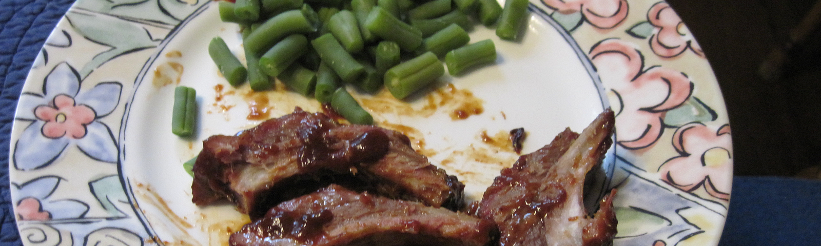 My photo of a delicious barbecued ribs and green beans meal.