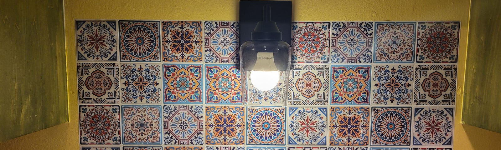 kitchen sink with tiles on the wall, every tile has a different geometric design