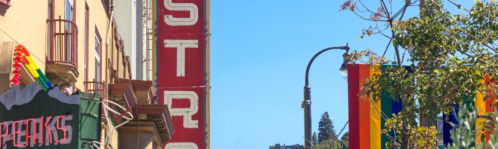 An image of Castro Street featuring the Casto Theater,once the center of gay culture, in San Francisco with a classic SF  hill in the distance