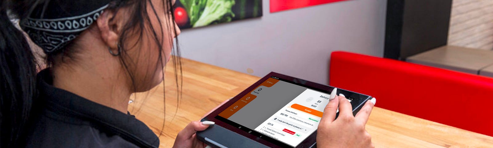 Restaurant staff member using the redesigned Orderpad restaurant app
