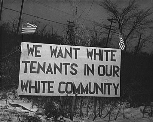 A sign from the era of segregation reading, “We want white tenants in our white community.”