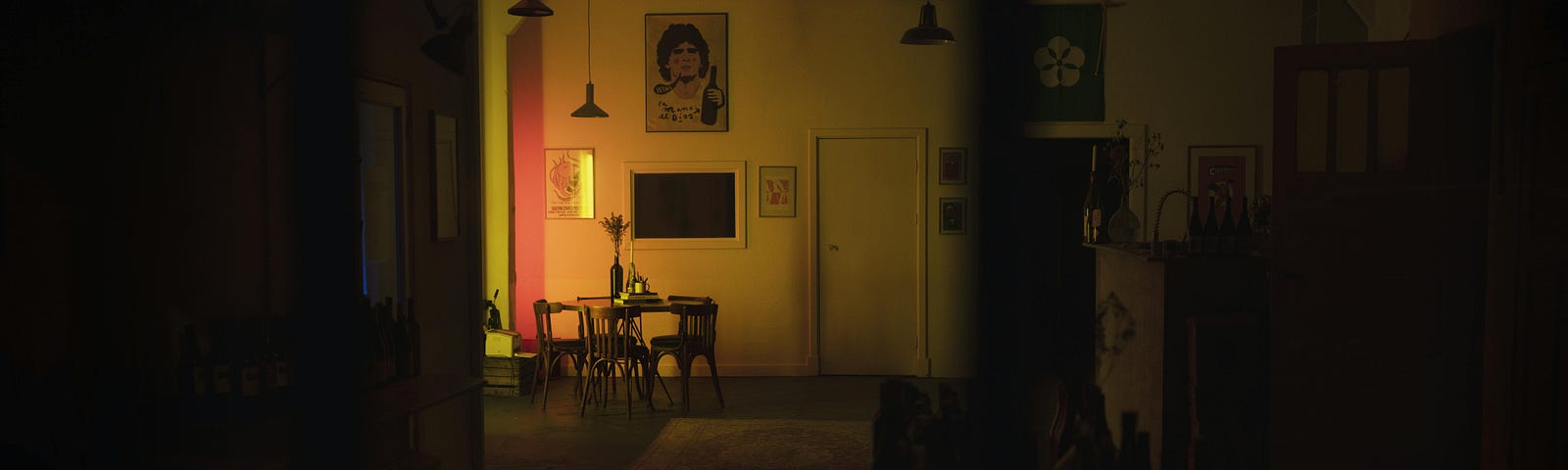 A photo of a dimly lighted dining room by Thomas balabaud from Pexels