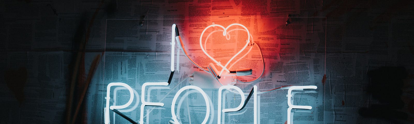 A neon sign saying I love people
