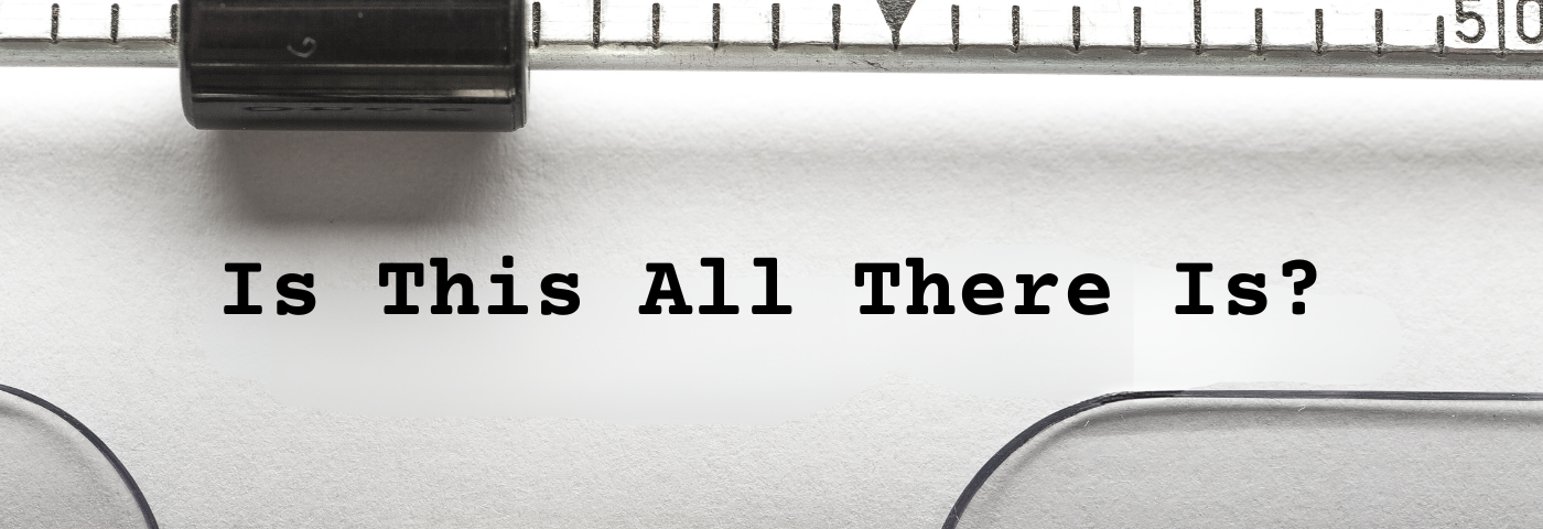 A typewriter with the title “Is This All There Is?”