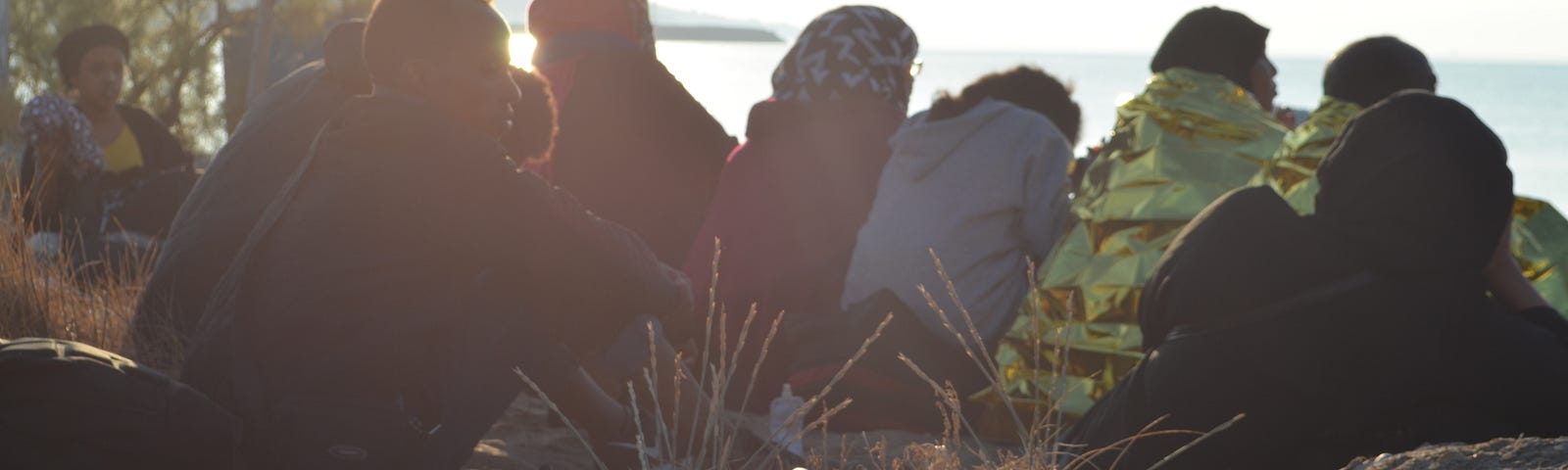 Refugees from Somalia and Iraq are detained by local police after arriving by boat on Chios, Greece. July 28, 2018. Photo by