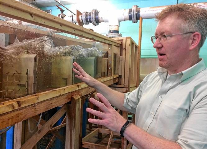 Dr. Towler and FWS Scholar, demonstrating an experiment at the USGS Conte Anadromous Fish Research Lab.