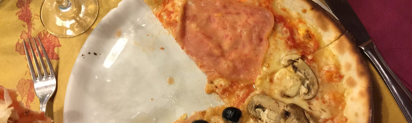 Part of an Italian Gluten-Free pizza photographed from above.