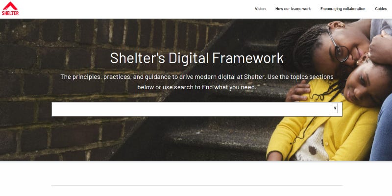 Screenshot of the frontpage of a website titled “Shelter’s Digital Framework”. It has a large search box in the middle and three links in the top right. The background picture is of a mother hugging her child.