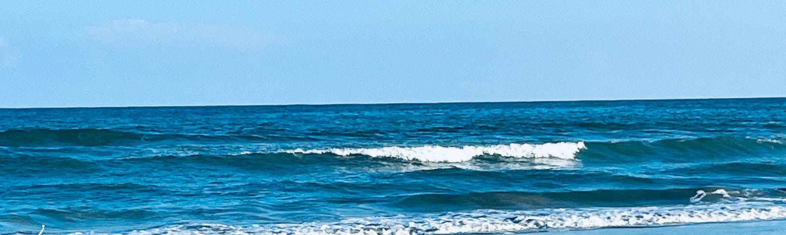 beach with waves rolling in