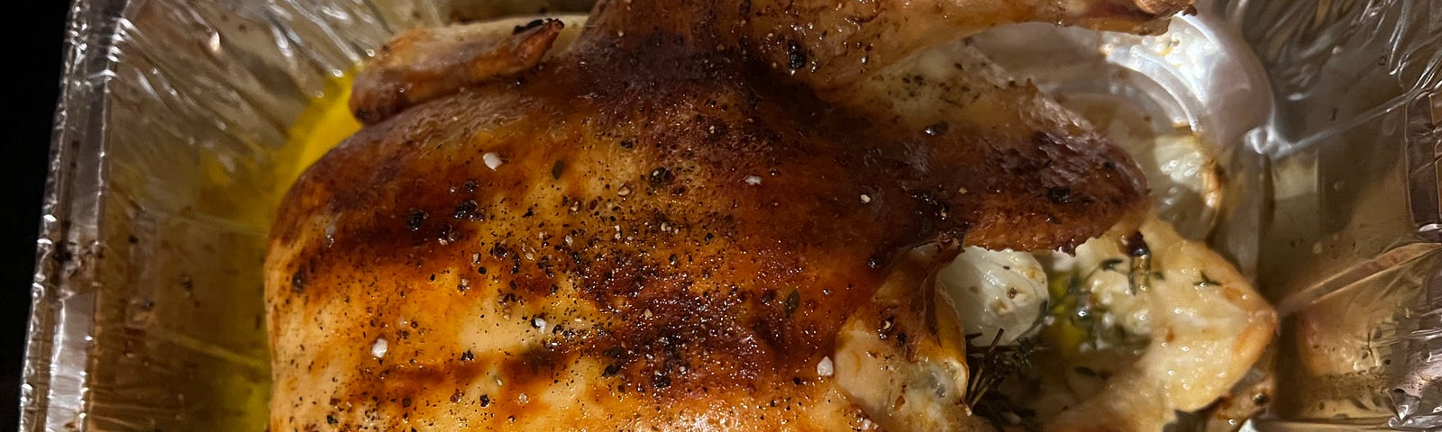 A roasted chicken, golden brown