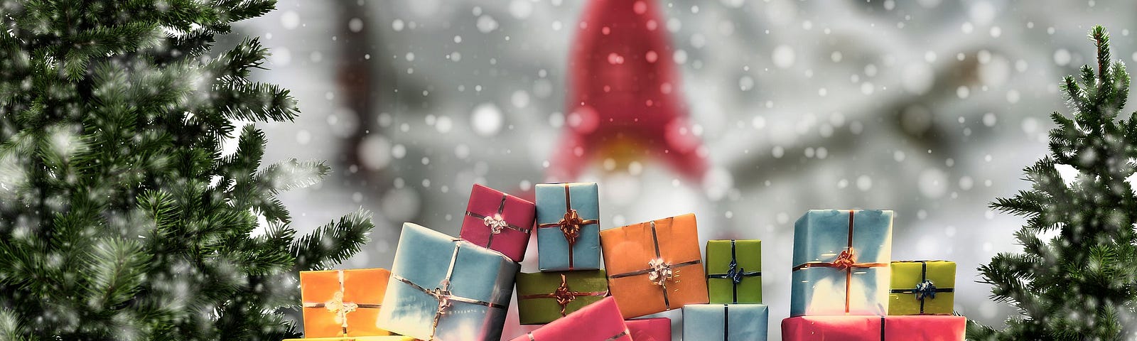 A pile of wrapped presents between two undecorated Christmas trees in a snowy scene with an elf standing behind the pile.