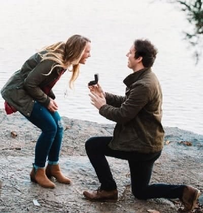Woman happily accepting her lovers engagement proposal that came about because the woman used this Make partner ask me to marry Powerful engagement spell.