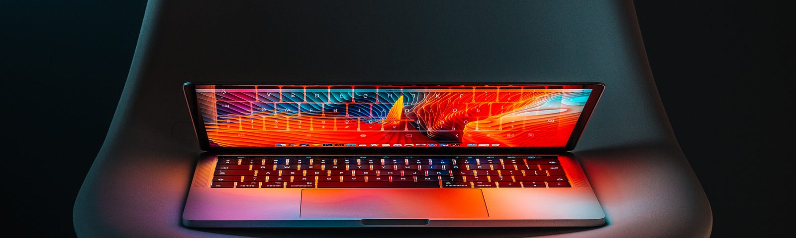 Half-flipped MacBook Pro on a chair