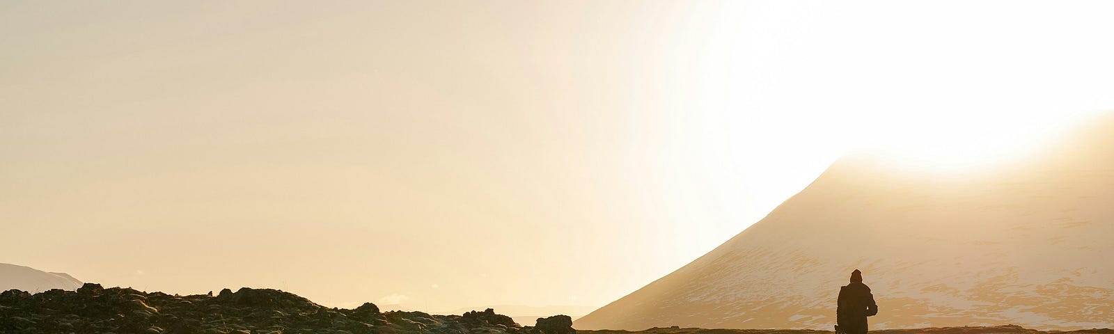 photo of person walking on curved road