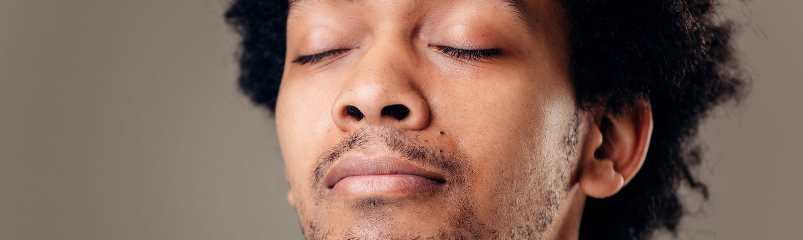 Portrait handsome young man, eyes closed. Stress relief techniques concept take deep breath. Positive human emotions, facial expression sign