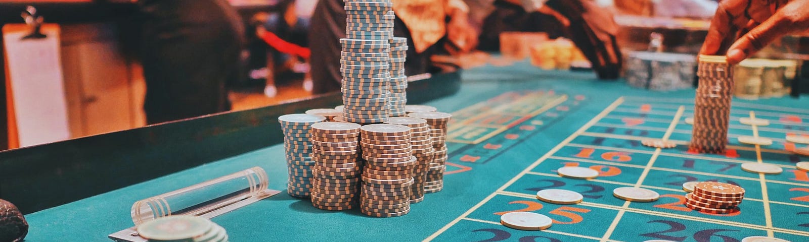 Casino gaming table with bets placed on numbers.