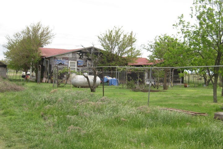 Jonica Bradley’s house as seen from the back during spring for the story Home Sweet Home