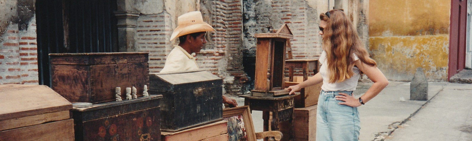 The author bargains with a seller of old furniture on the street.