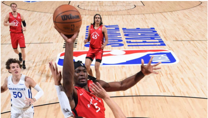 Precious Achiuwa finishing over his defender in the paint