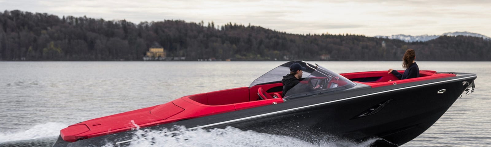 A view of the M 800-R luxury electric yacht cruising on an open lake.