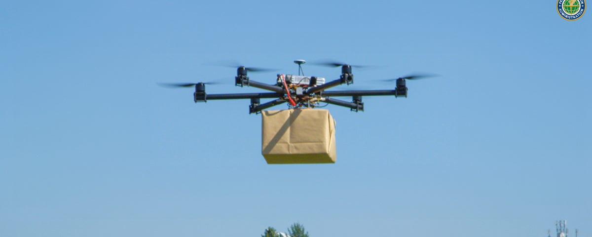 A drone delivering a package over a suburban community.