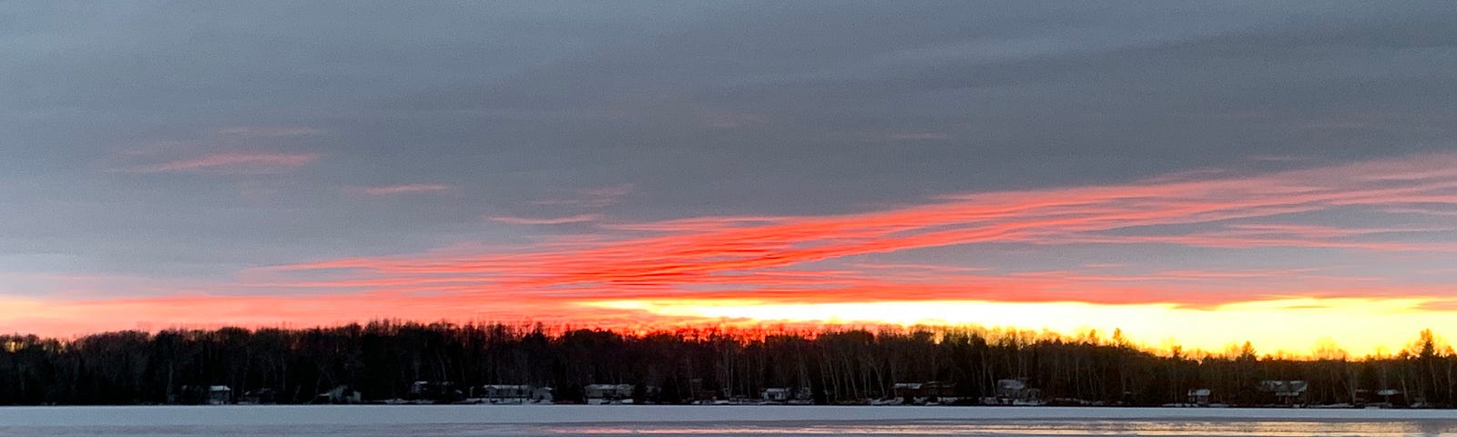 Sunset under clouds above a frozen lake, Wisconsin. IMAGE CREDIT: Laurel Haak