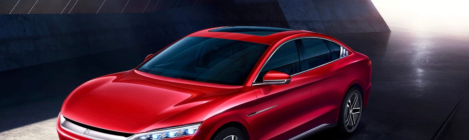 A closer look at a typical BYD electric vehicle in the color of red.