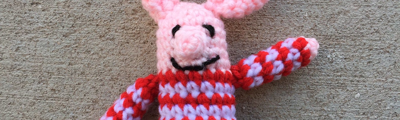 A miniature meta crochet pig named Olivette