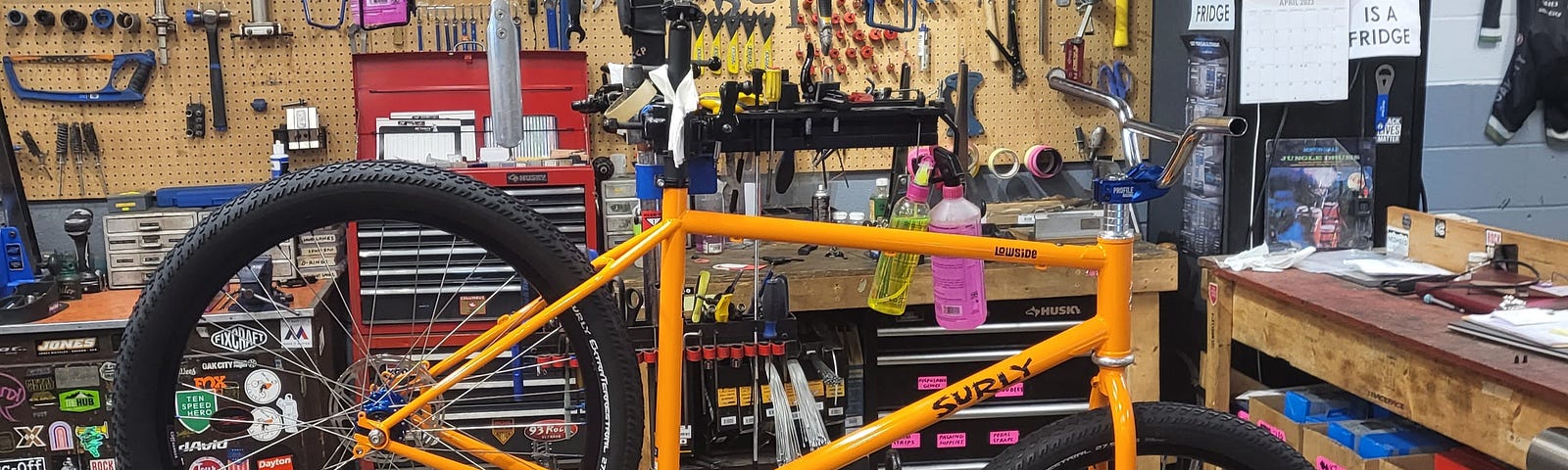 Partially built bicycle on a work stand in a bike shop