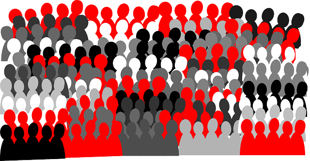 An abstract depiction of a crowd of people in small patches of color (read, black, white, and a few shades of gray)