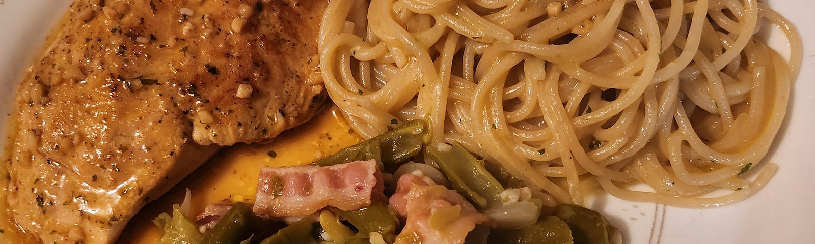 Garlic buitter chicken and noodles with green beans and bacon.