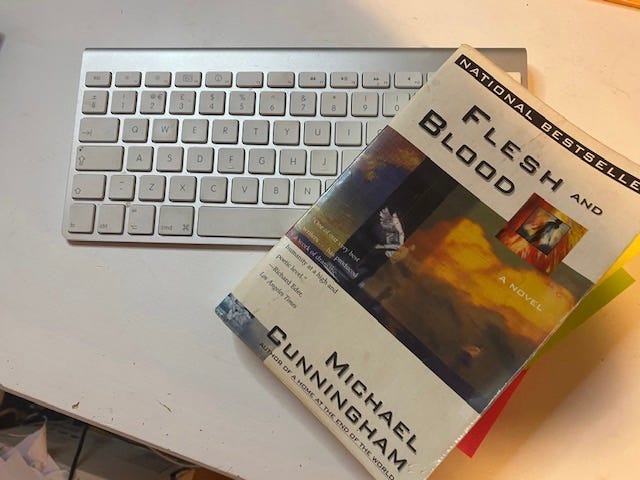 A copy of Michael Cunningham’s “Flesh and Blood” atop a keyboard.