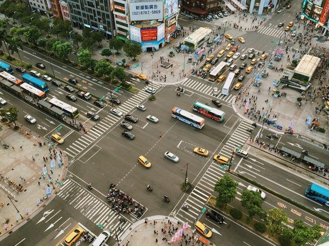 A busy, 4-way intersection with cars crossing