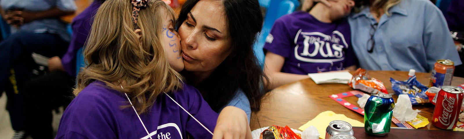 A daughter kisses her mother at California Institute for Women state prison in Chino, California, May 5, 2012. Photo by Algerina Perna/Reuters