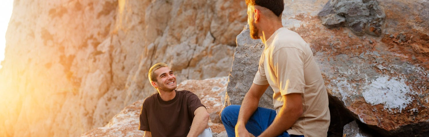 Image of two humans having a conversations with the sun in the background to illustrate the beauty of the human spirit as described in the near-death experience.