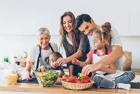 Photo of happy healthy family making a meal