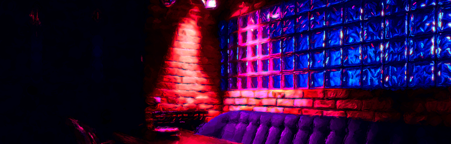 Dimly lit tables and sofa in a nightclub