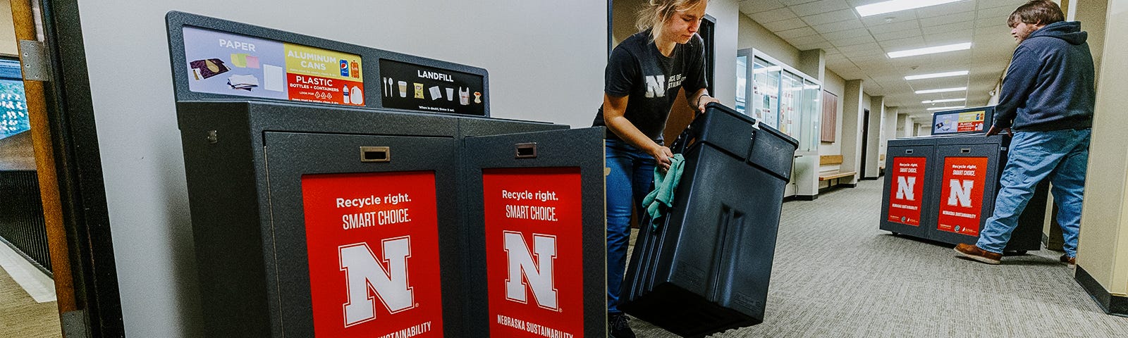 Staff place new recycling bins on campus