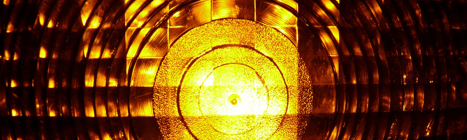 Closeup of amber warning light showing inner reflectors.