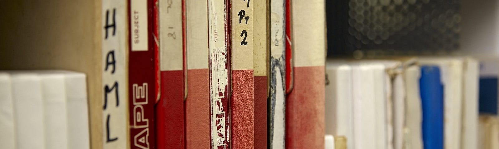 close up of audio files on a shelf in the storage area at the John Rylands Library.