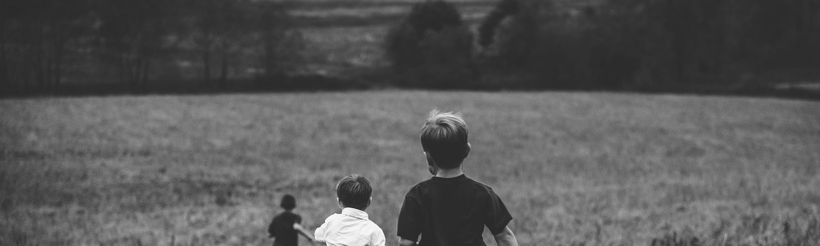 boys running, a Photo by Jordan Whitt on Unsplash