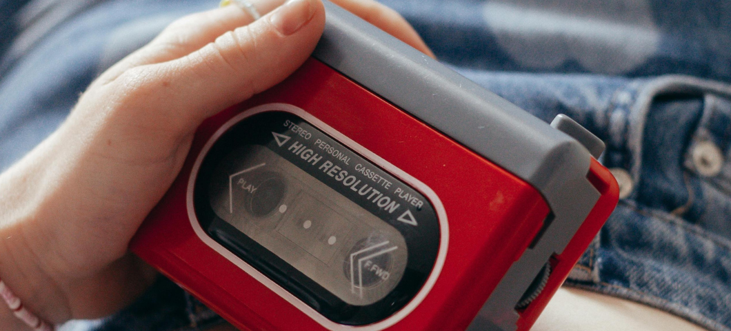 girl holding a cassette tape player