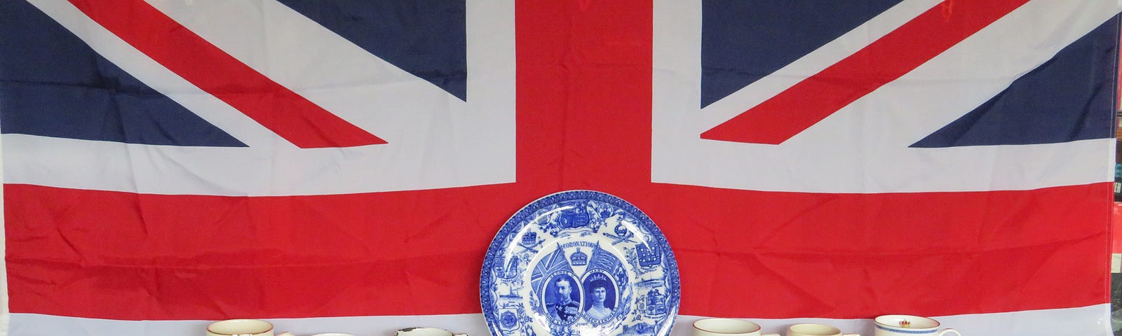 Image showing Collection of 6 Coronation & Jubilee Mugs & Plate set against the UK National Union flag