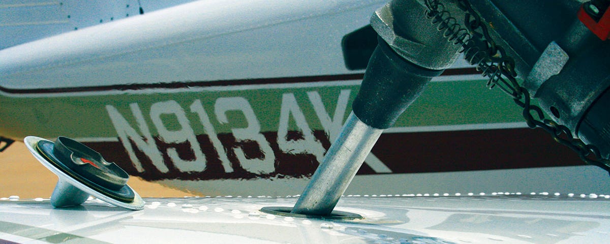 Photo of pumping gas into an airplane.