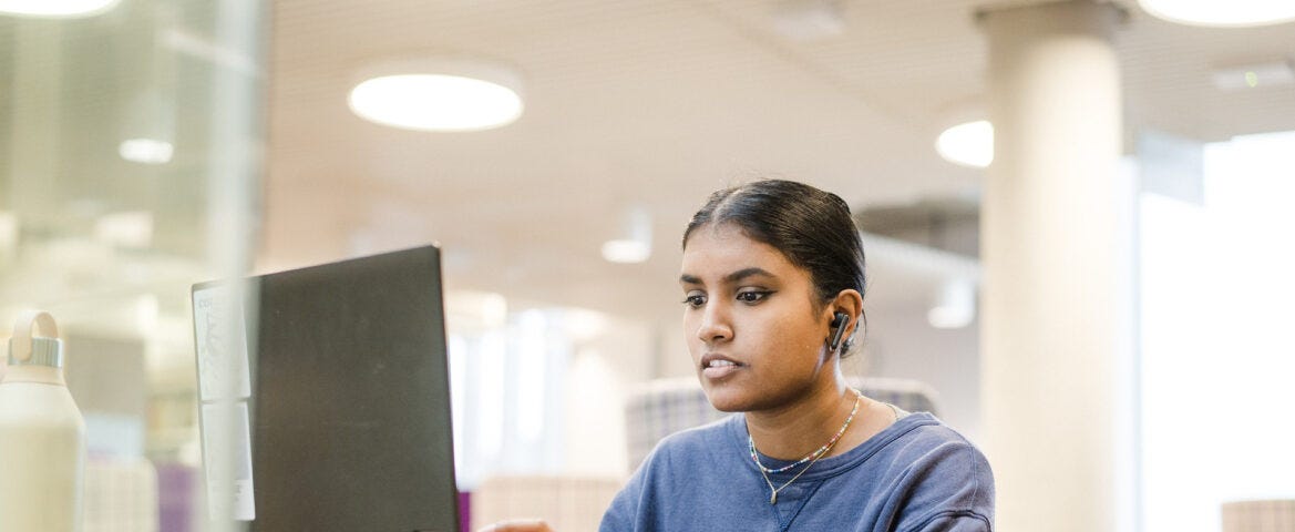 A student studying on their laptop.