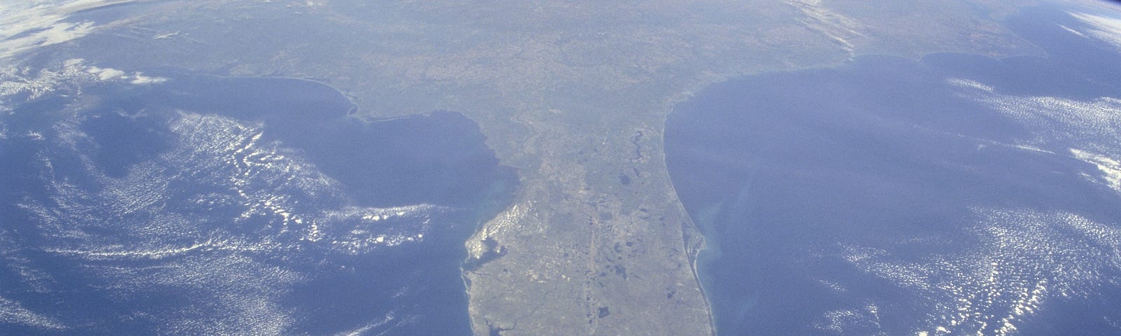 From above Cuba, this photo shows an oblique, foreshortened view of the Florida Peninsula & the curvature of Earth from space