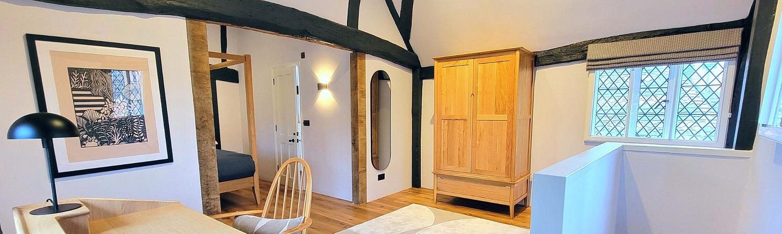 The uppermost of three floors in 6 Priory Row cottage is a spacious master suite. Photo by Laura Metze.