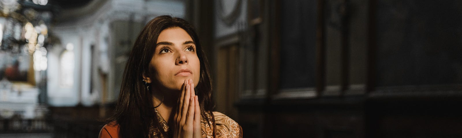 A Lady praying with folded hands