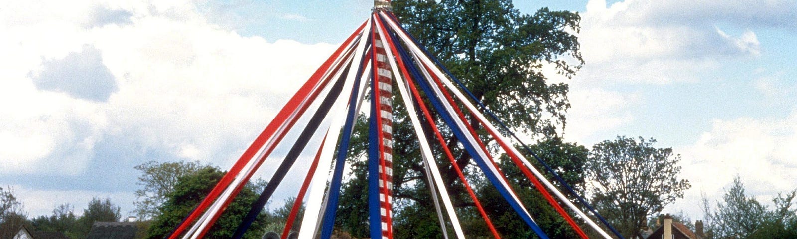Maypole dance — a tall pole with ribbons hanging from the top with dancers holding the ends and moving around to form complex patterns