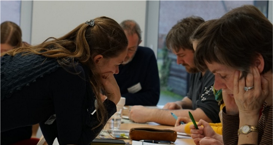 Participants filling out a survey on their values concerning grasslands (Photo by Lea Pöllmann).